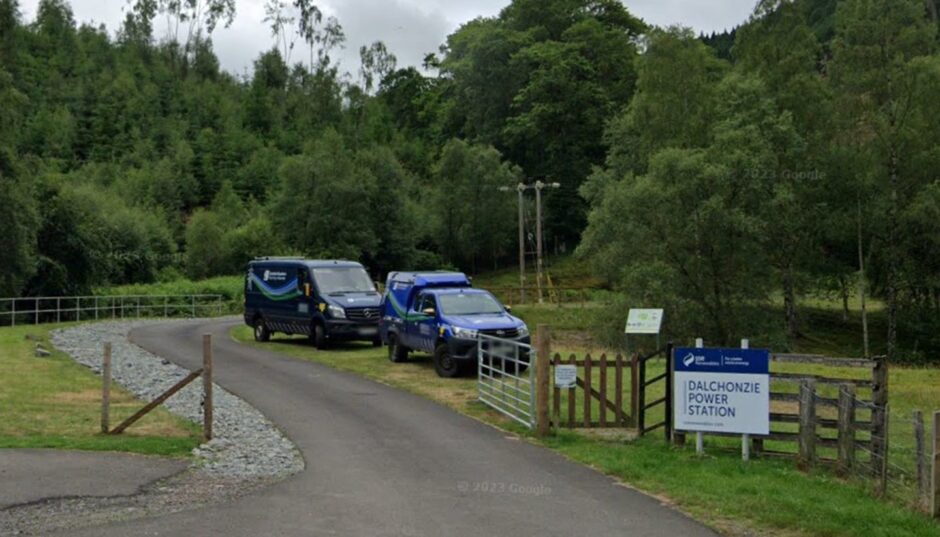 Entrance to Dalchonzie power station with sign and SSE vans parked beside it