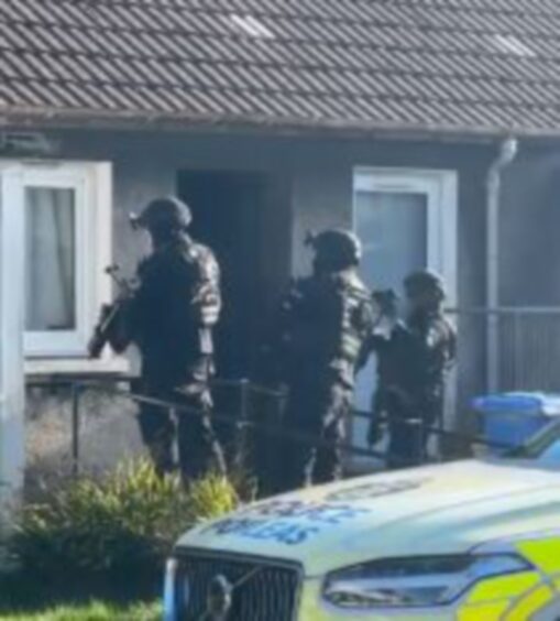 Armed police in Kinglassie