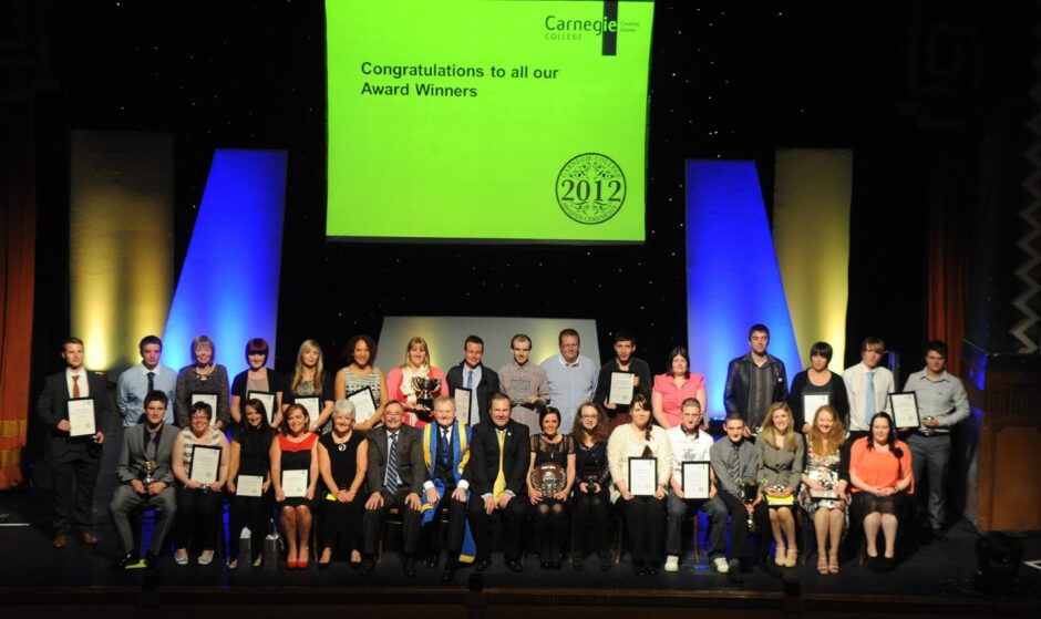 The Carnegie College award winners seated on stage with their certificates in 2012