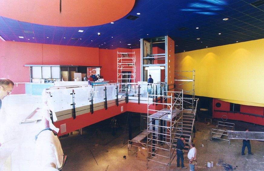 scaffolding and workers as work goes on inside the nascent Dundee Cineworld 