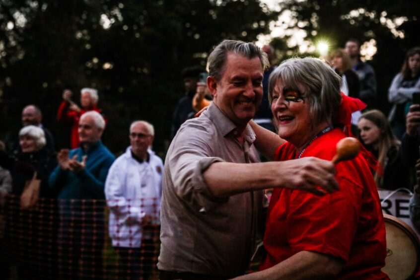 Head Teacher Tracey Ford-McNicol being hugged at end of firewalk