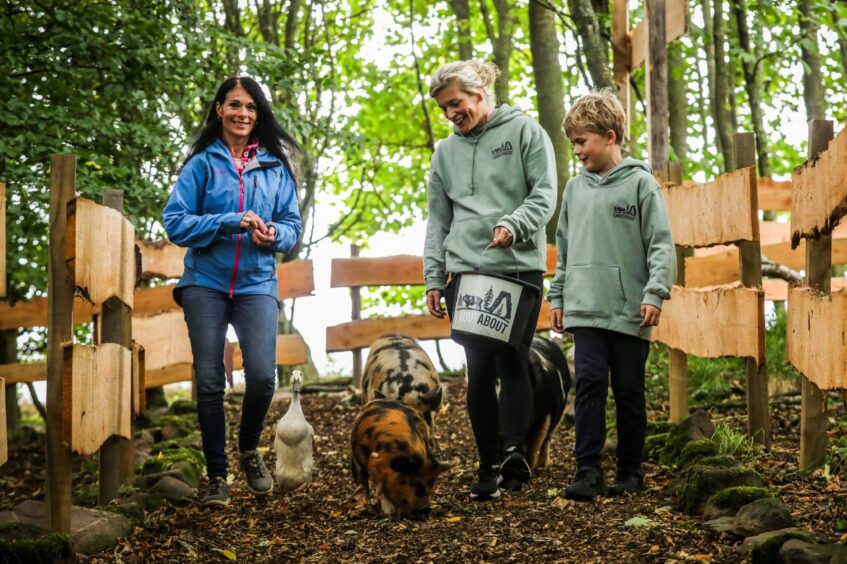 Gayle with Kirsty Brown and her son Joe Brown, 7 with the piggies and their best mate Dobby the duck. Image: Mhairi Edwards/DC Thomson.