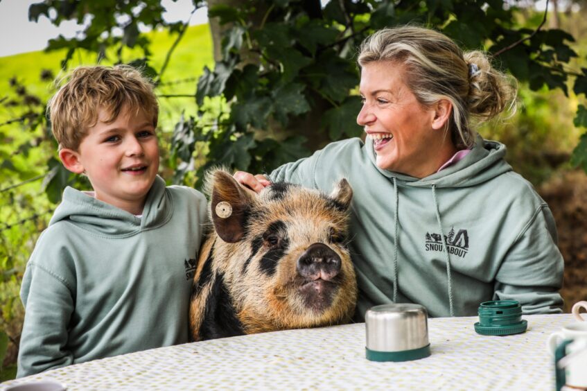 Kirsty Brown and her son Joe Brown, 7 with Pickles who came to join them at their pig-nic. Image: Mhairi Edwards/DC Thomson.