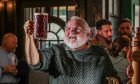 John Justice, owner of Dundee's Pillars Bar, with a pint of beer. Image: Mhairi Edwards/DC Thomson.