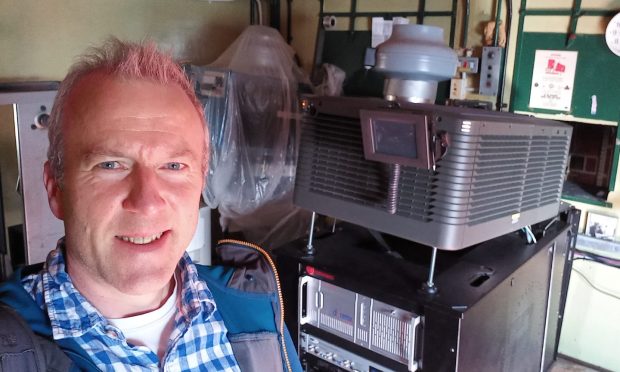 Michael Alexander returns to the New Picture House projection room for the first time since July 1995. Image: Michael Alexander