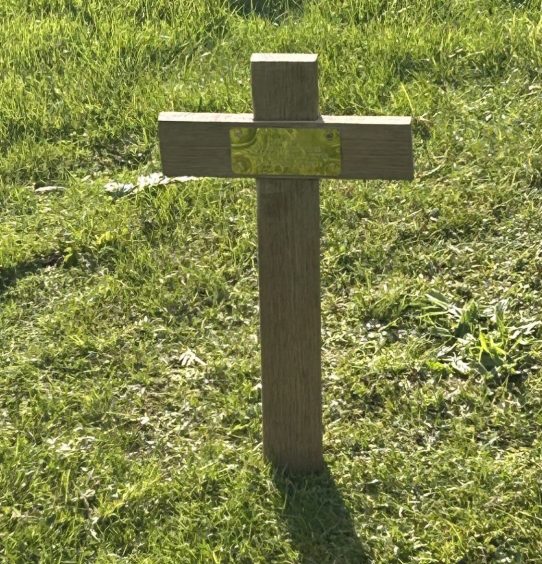 Caroline has already placed a cross at baby Pearl's grave near a memorial to Fife stillborn babies.