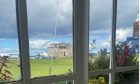 A large crack in the window at Rusacks Hotel overlooking St Andrews Old Course