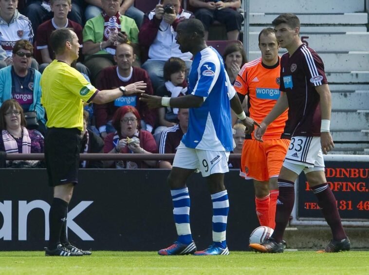 Gregory Tade protests his innocence at Tynecastle. 