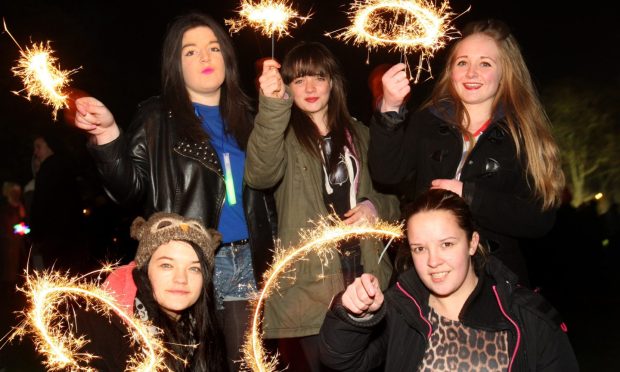 A group of girls with sparklers at the bonfire night event in Baxter Park in Dundee in 2013.