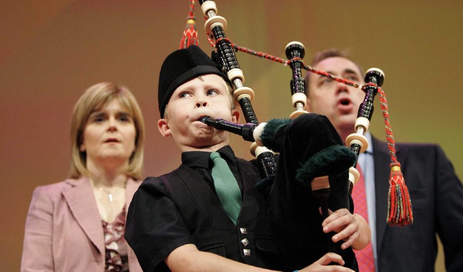 Connor Sinclair, then aged 10, playing Scots Wha Hae at the annual SNP conference in Perth in 2006, with Nicola Sturgeon and Alex Salmond behind him. 