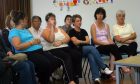 Concerned members of the Langlands Primary School board in 2005 at a meeting to discuss the future of the school, which closed in 2006. Falling school rolls were at least in part due to affordable housing pressures. Image: DC Thomson