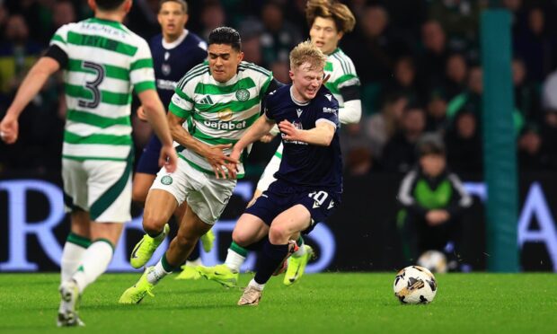 Lyall Cameron in possession for Dundee at Celtic Park. Image: David Young/Shutterstock