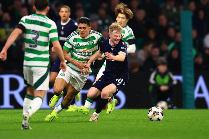 Lyall Cameron in possession for Dundee at Celtic Park. Image: David Young/Shutterstock