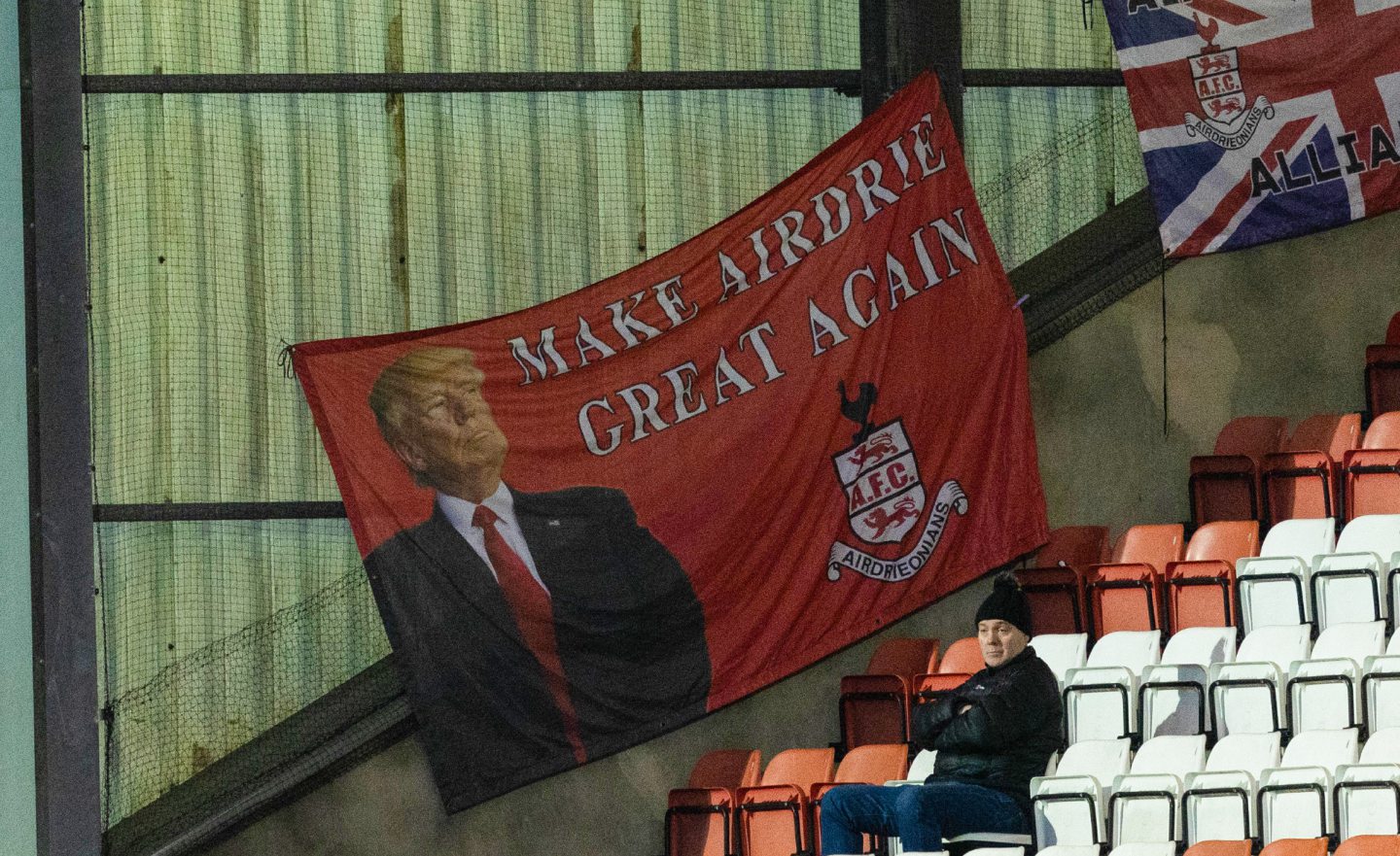 Airdrie fans displaying a "Make Airdrie Great Again" flag.