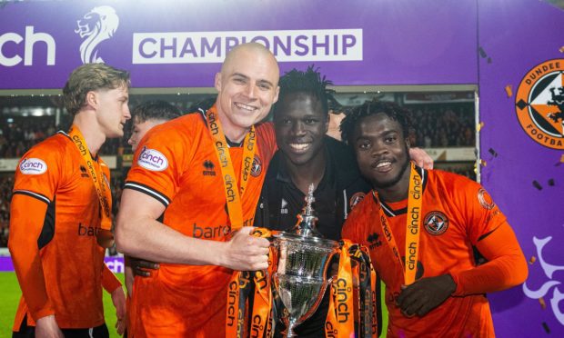 Sadat Anaku, centre, celebrates United's Championship win