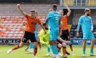 Dundee United's Ross Graham, left, celebrates his winning goal against St Mirren at Tannadice