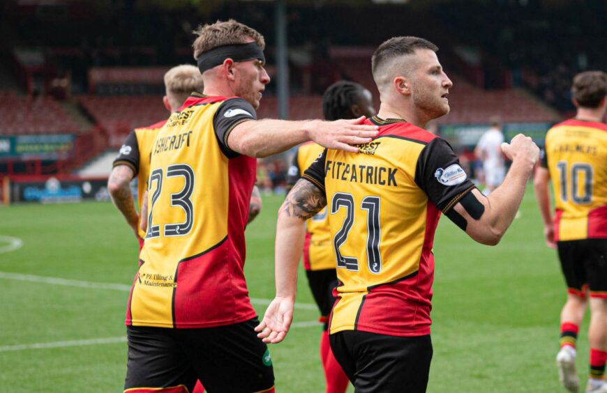 Lee Ashcroft, complete with head bandage, celebrates with Partick Thistle. Image: Ewan Bootman/SNS