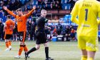 Craig Napier points to the spot deep into stoppage time