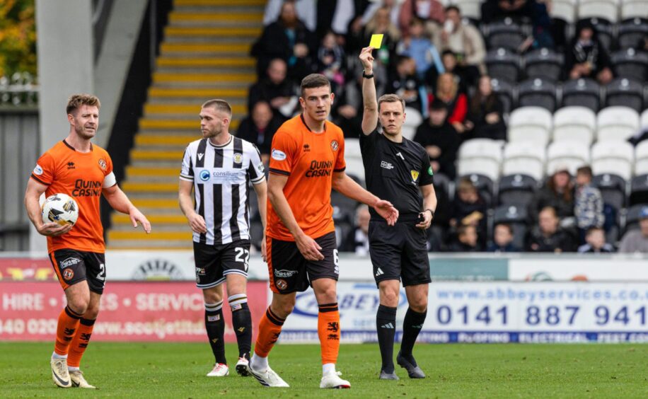 Dundee United's Ross Graham sees yellow against the Buddies