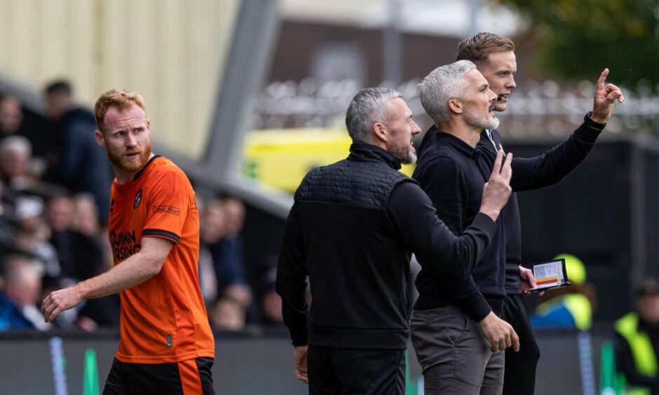 Dundee United's Jort van der Sande, left, takes his leave prior to the interval.