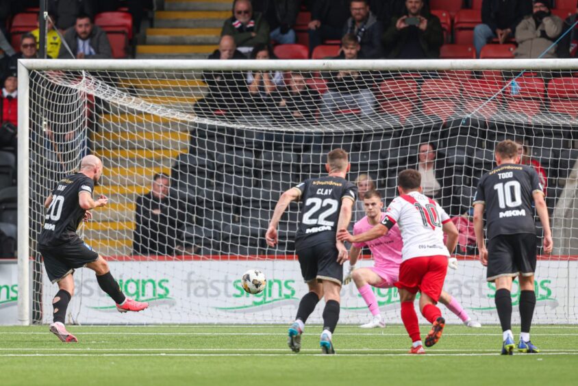 Pars striker Chris Kane fires in his penalty against Airdrie.