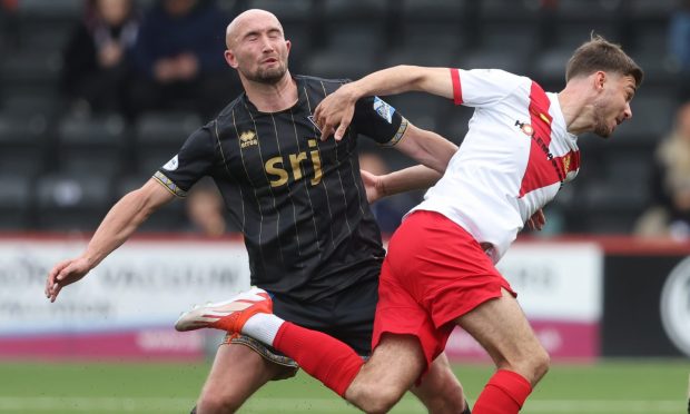 Dunfermline Athletic striker Chris Kane battles for possession against Airdrie.