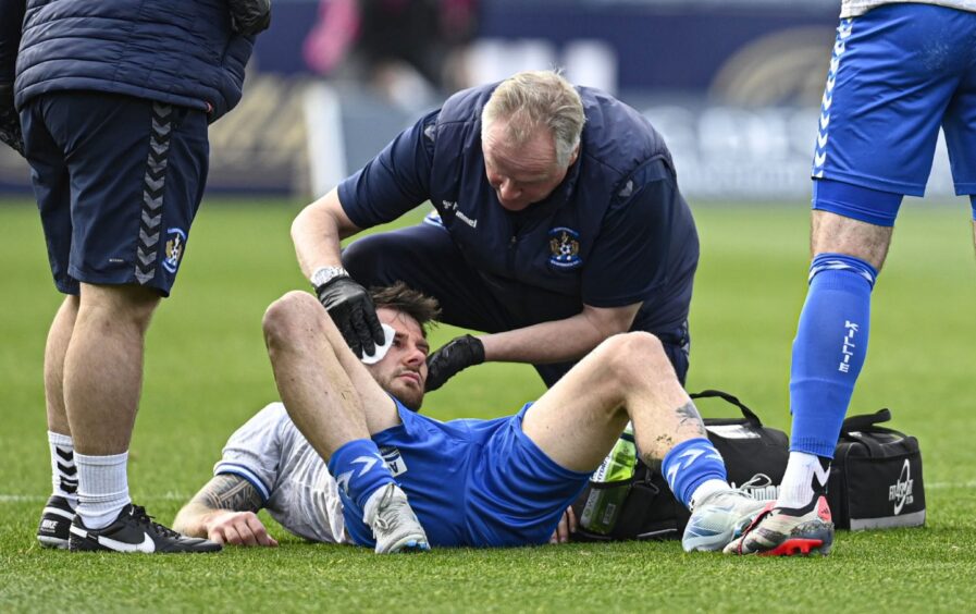 Matty Kennedy gets treatment. Image: Rob Casey/SNS