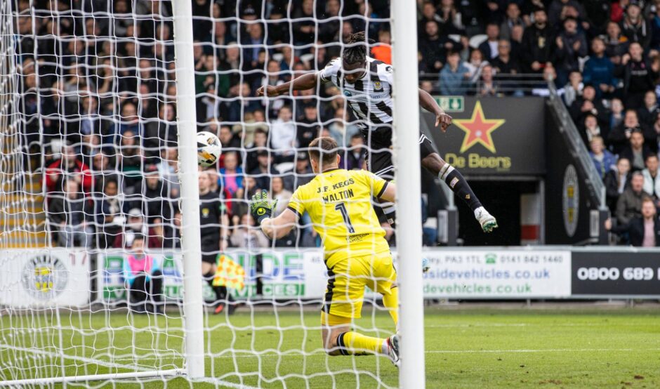 Toyosi Olusanya skews his header wide following a sensational Jack Walton save