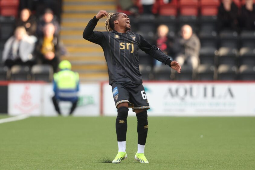 Dapo Mebude is all action for Dunfermline.