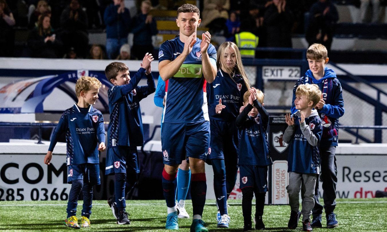 Ross Matthews returns the applause of the Raith Rovers fans at his testimonial.