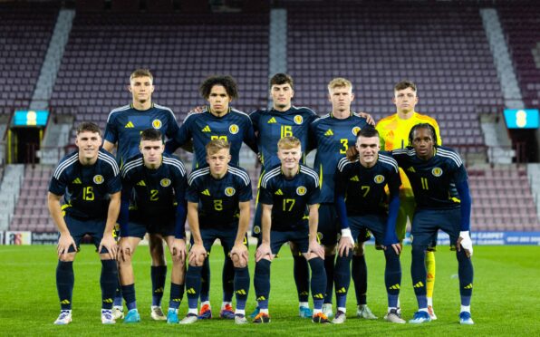 The Scotland side line-up ahead of kick-off, featuring Saints' Lewis Neilson (back row, third from left), Dundee's Josh Mulligan (front row, first left) and Dens team-mate Lyall Cameron (front row, fourth left). Image: Ross Parker/SNS