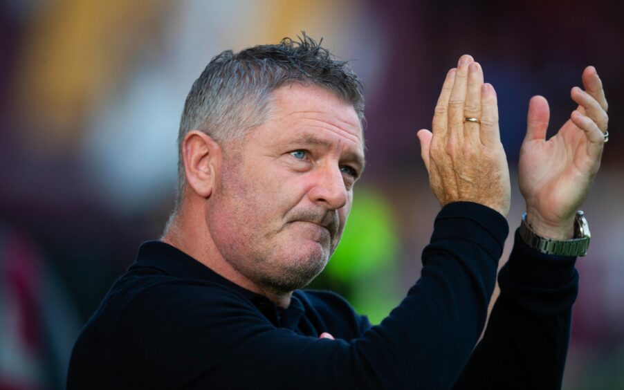 Tony Docherty salutes the Dundee fans at Motherwell. Image: Sammy Turner/SNS