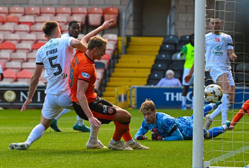 Dundee United's Sam Dalby pokes home his first goal against Hibs at Tannadice last month.