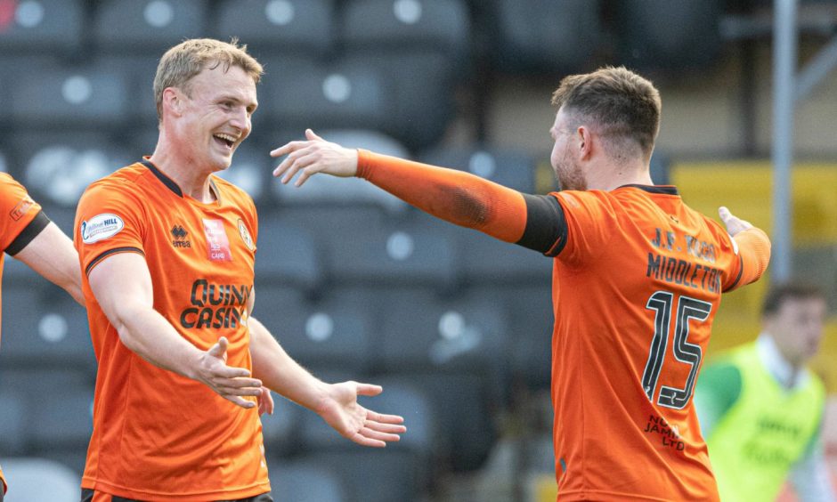 Sam Dalby, left, toasts Glenn Middleton following his super assist.