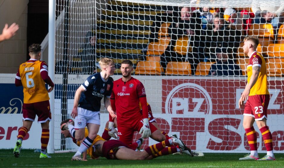 Lyall Cameron wheels away after opening the scoring for Dundee. Image: Sammy Turner/SNS