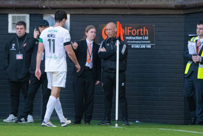 Joe Newell of Hibs is given a red card against Dundee United