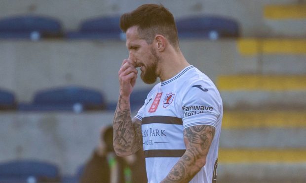 Dylan Easton looks to the ground dejectedly after being shown a red card in Raith Rovers' 1-1 draw with Queen's Park.