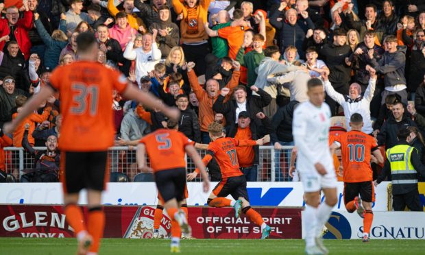 Luca Stephenson, No.17, celebrates his second Dundee United goal of the season against Hibs