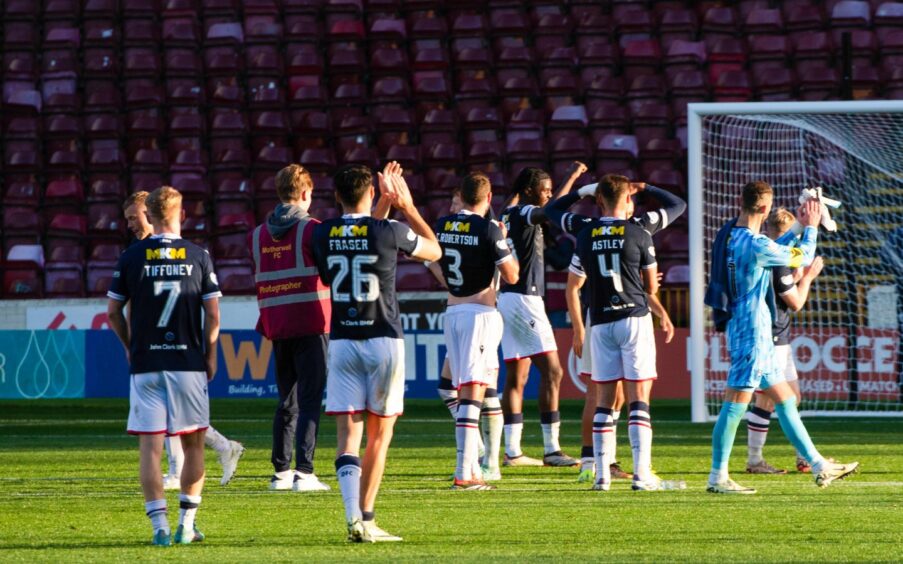 Dundee players salute away fans at Motherwell. Image: SNS