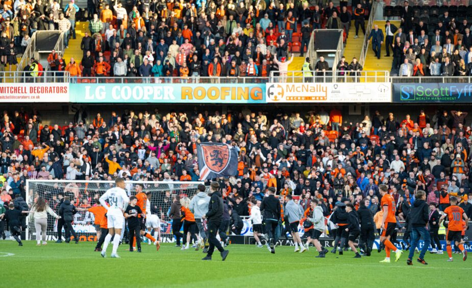 The scenes that followed Meshack's winner as fans spilled onto the pitch.