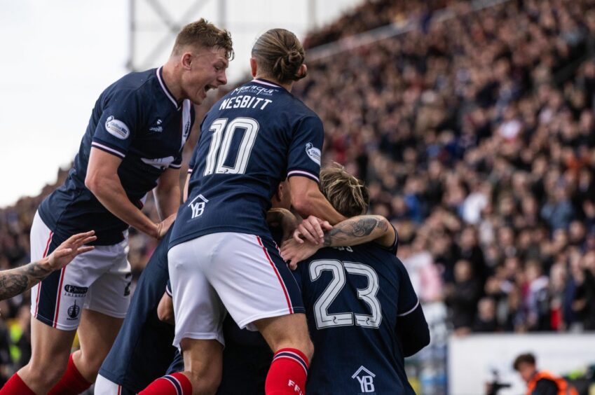 Falkirk celebrate their fortuitous opening goal against Dunfermline Athletic.