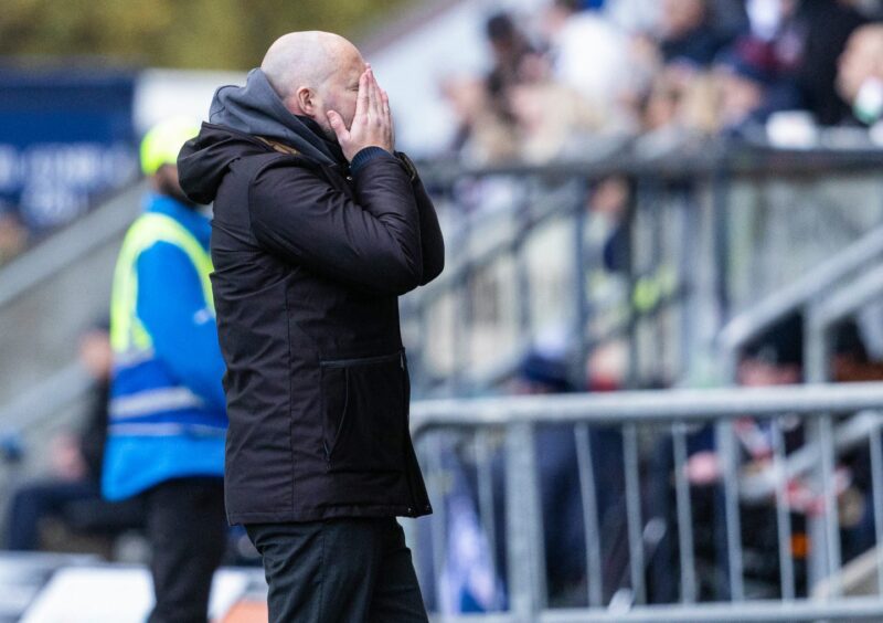 Pars boss James McPake hides his face in his hands during the defeat to Falkirk.