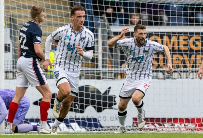 Lewis McCann wheels away with Craig Clay after scoring to give Dunfermline Athletic hope against Falkirk.