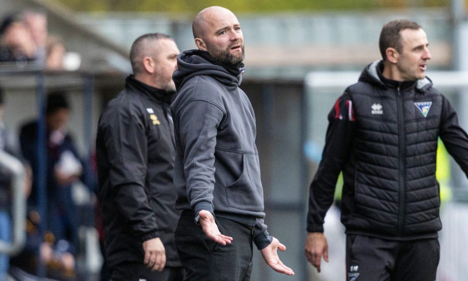 Ex-DAFC manager James McPake on the sidelines.