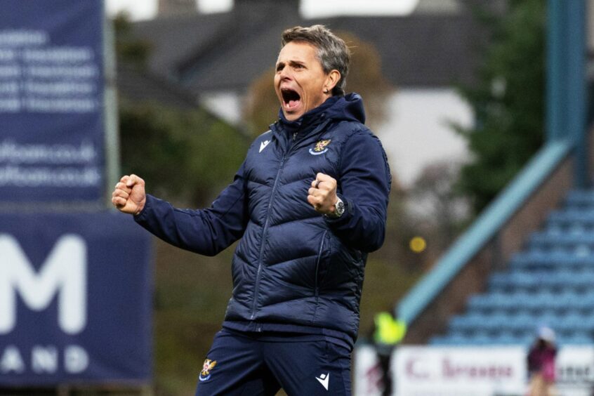 Simo Valakari clenches his fists and celebrates at full-time. 