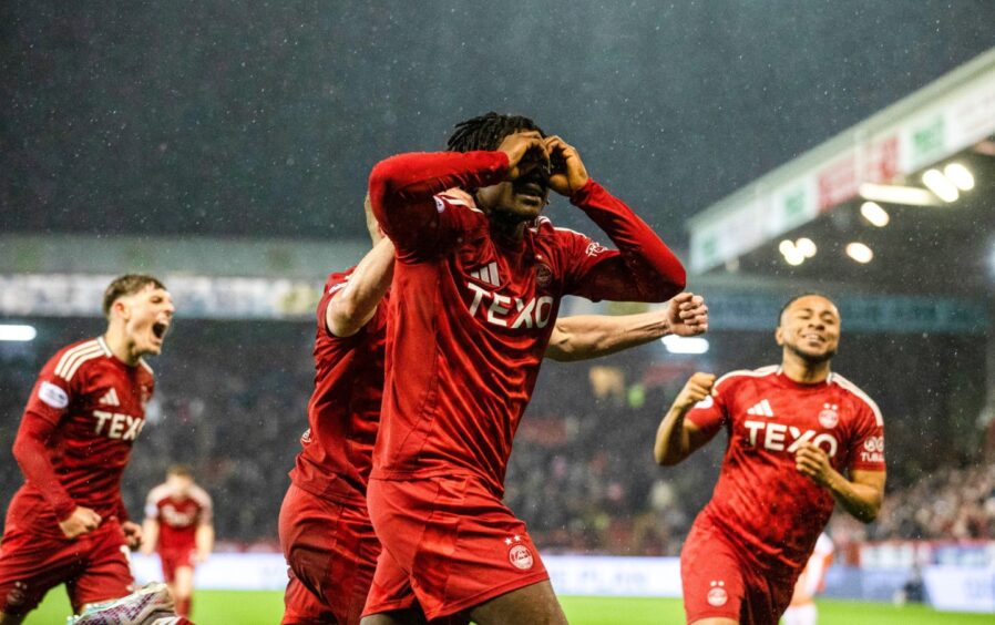 Peter Ambrose wheels away to celebrate his decisive strike.