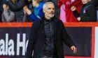 Jim Goodwin walks the touchline at Aberdeen