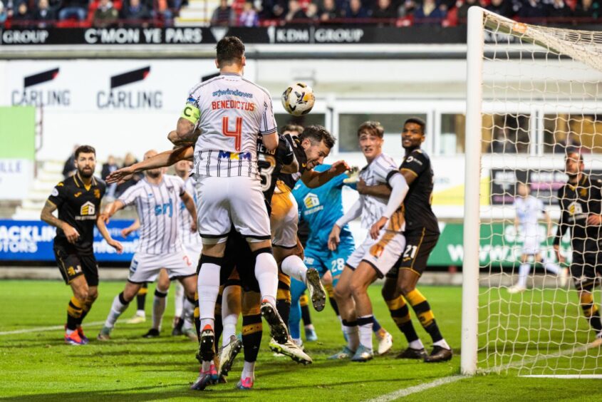 Kyle Benedictus rises highest to head into the net for Dunfermline Athletic.