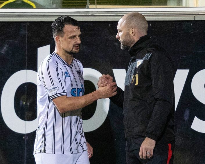 Kyle Benedictus shakes hands with Dunfermline Athletic F.C. manager James McPake. 