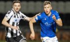 Sven Sprangler running beside a St Mirren player while playing for St Johnstone.